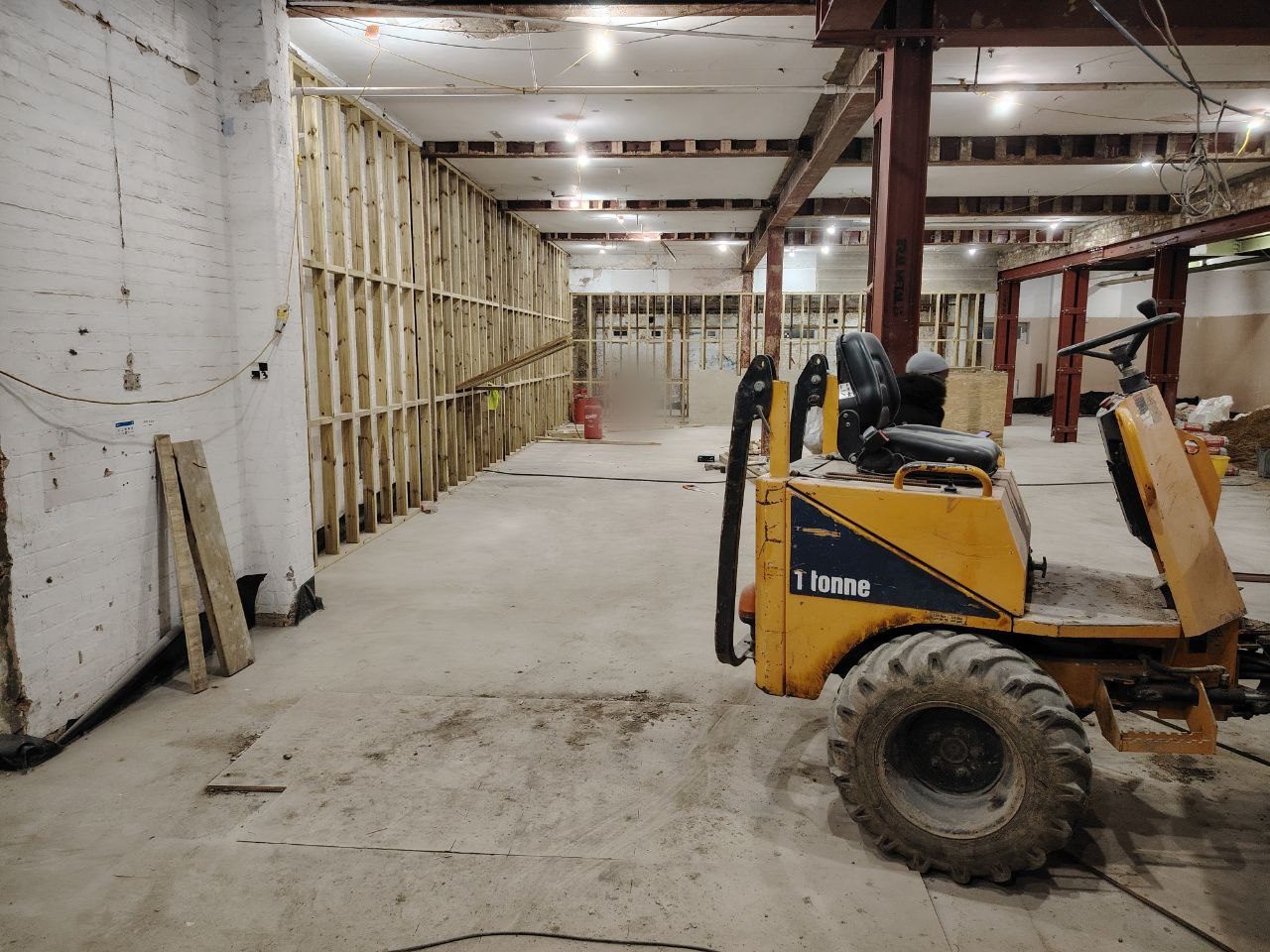 Interior corridor being stripped out during demolition