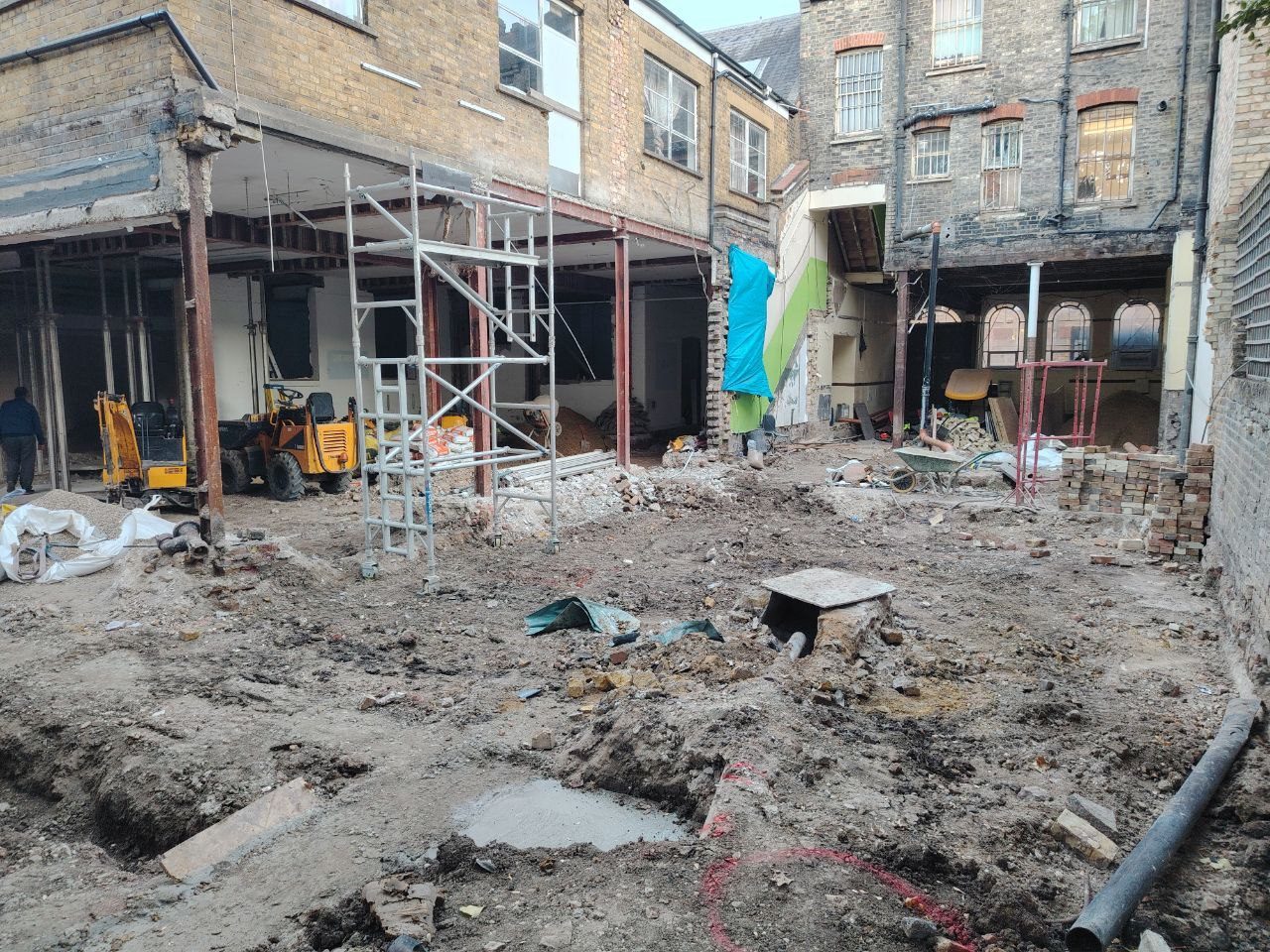 Major internal demolition with early steelwork overhead