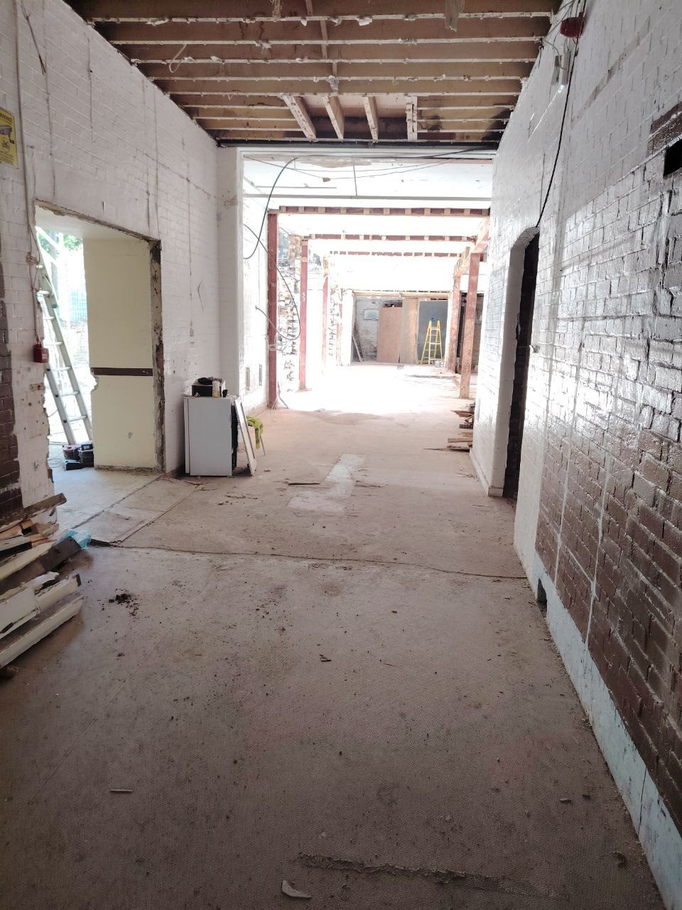 New floor slab down with first stud walls going up